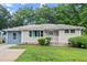 Beautiful one-story home with a freshly painted exterior, manicured bushes, and a well-kept lawn at 2756 Gresham Se Rd, Atlanta, GA 30316