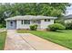 Well-maintained single-story home featuring a spacious front yard, a long driveway, and a neatly landscaped exterior at 2756 Gresham Se Rd, Atlanta, GA 30316