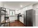 Modern kitchen boasts white cabinets, granite countertops, stainless steel appliances, and hardwood floors at 2756 Gresham Se Rd, Atlanta, GA 30316