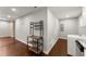 Laundry area with modern washer, shelving, and adjacent utility connections at 2756 Gresham Se Rd, Atlanta, GA 30316