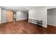 Open-concept living room features hardwood floors, fresh paint, and a decorative sliding barn door at 2756 Gresham Se Rd, Atlanta, GA 30316