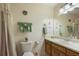 Well-lit bathroom featuring a vanity with ample counter space and decorative accents at 291 N Briar Rdg, Woodstock, GA 30189