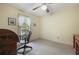 Spare bedroom features a vintage desk and chair, natural light, and carpeted floors at 291 N Briar Rdg, Woodstock, GA 30189