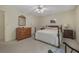 Spacious bedroom features carpeted floors, a bed, dresser, and abundant natural light at 291 N Briar Rdg, Woodstock, GA 30189