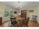 Bright dining room features hardwood floors, classic chandelier, and access to screened-in porch at 291 N Briar Rdg, Woodstock, GA 30189