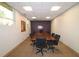 Conference room features a long wooden table and multiple chairs for meetings at 3060 Pharr Court North Nw # 719, Atlanta, GA 30305