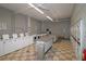 Communal laundry room offers multiple washing machines and dryers for resident convenience at 3060 Pharr Court North Nw # 719, Atlanta, GA 30305