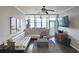 Cozy living room featuring large windows and a comfortable seating arrangement at 3060 Pharr Court North Nw # 719, Atlanta, GA 30305