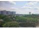 Scenic view overlooking lush green trees and buildings with cloudy sky in the background at 3060 Pharr Court North Nw # 719, Atlanta, GA 30305