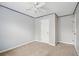 Bedroom featuring neutral carpet, a ceiling fan with light, and a window at 760 Celeste Sw Ln, Atlanta, GA 30331