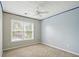 Carpeted bedroom with window and ceiling fan offers a cozy space at 760 Celeste Sw Ln, Atlanta, GA 30331