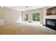 Spacious living room featuring a fireplace and sliding glass doors to a deck at 760 Celeste Sw Ln, Atlanta, GA 30331