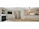 Open concept living room with a fireplace and view into the kitchen at 760 Celeste Sw Ln, Atlanta, GA 30331