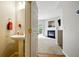 Cozy powder room with a pedestal sink and hardwood floors at 760 Celeste Sw Ln, Atlanta, GA 30331