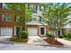 Charming townhouse with brick and siding exterior, front yard, and attached garage at 760 Celeste Sw Ln, Atlanta, GA 30331