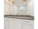 Elegant bathroom features marble countertops, white cabinetry, and stylish pendant lighting at 260 Guild Ln, Fayetteville, GA 30214