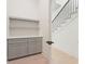 Hallway with stairs, built-in cabinets, and white walls at 260 Guild Ln, Fayetteville, GA 30214