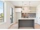 Modern kitchen with a gray island, stylish pendant lights, and stainless steel appliances at 260 Guild Ln, Fayetteville, GA 30214