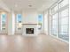 Bright living room with fireplace, hardwood floors, and large windows at 260 Guild Ln, Fayetteville, GA 30214