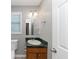 Updated bathroom with granite vanity, modern fixtures, and a tile floor at 409 Ivy Terrace Dr, Dallas, GA 30157