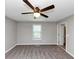 This inviting bedroom features a ceiling fan, plush carpet and neutral colors at 409 Ivy Terrace Dr, Dallas, GA 30157