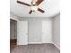 This cozy bedroom features plush carpet, ceiling fan and neutral paint at 409 Ivy Terrace Dr, Dallas, GA 30157