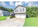 Charming two-story home with a spacious driveway and well-maintained front yard at 409 Ivy Terrace Dr, Dallas, GA 30157