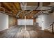 Spacious garage featuring two white garage doors and an unfinished ceiling at 409 Ivy Terrace Dr, Dallas, GA 30157