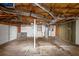 Spacious garage featuring one white garage door, unfinished ceiling, and access to stairs at 409 Ivy Terrace Dr, Dallas, GA 30157