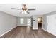 Bright living room with hardwood floors and an adjacent kitchen area at 409 Ivy Terrace Dr, Dallas, GA 30157