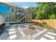 Backyard with a fire pit, patio, deck, and outdoor living and entertaining space at 148 Copper Hills Dr, Canton, GA 30114