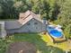 Aerial view of backyard with an above-ground pool and lush greenery at 148 Copper Hills Dr, Canton, GA 30114