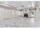 Finished basement with fireplace, recessed lighting, and wood-look flooring, ideal for entertaining or relaxing at 148 Copper Hills Dr, Canton, GA 30114