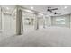 Spacious open basement with plush carpeting, neutral tones, and ceiling fans at 148 Copper Hills Dr, Canton, GA 30114