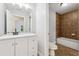 Stylish bathroom with white vanity, modern fixtures, and tiled shower/tub combo, providing a clean and functional space at 148 Copper Hills Dr, Canton, GA 30114