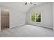 Neutral bedroom with grey carpet, vaulted ceilings and large window, perfect for a comfortable retreat at 148 Copper Hills Dr, Canton, GA 30114