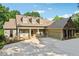 Charming exterior elevation showcasing the home's craftsman design and well-manicured landscaping at 148 Copper Hills Dr, Canton, GA 30114
