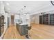 Bright kitchen with stone island, white cabinets, stainless appliances, seating and open design at 148 Copper Hills Dr, Canton, GA 30114