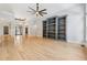 Spacious living room boasts hardwood floors, built-in shelving, and stylish lighting at 148 Copper Hills Dr, Canton, GA 30114