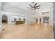 Open floor plan featuring a stone-accented kitchen island and a living space with a fireplace at 148 Copper Hills Dr, Canton, GA 30114