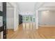 Bright living room featuring hardwood floors, built-in shelving, and large windows with lots of natural light at 148 Copper Hills Dr, Canton, GA 30114