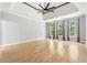 Bright main bedroom boasts hardwood floors and three large windows, filling the space with natural light at 148 Copper Hills Dr, Canton, GA 30114