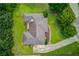 Aerial view of property showing layout and landscaping, complemented by mature trees and a lush lawn at 2005 Ashton Pointe Dr, Dacula, GA 30019