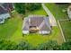 Aerial view of home showing backyard, deck and lush greenery with a private backyard at 2005 Ashton Pointe Dr, Dacula, GA 30019