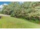 A verdant backyard provides a place for outdoor living at this home at 2005 Ashton Pointe Dr, Dacula, GA 30019