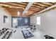 Home gym featuring weightlifting equipment and exposed ceiling in a well-lit basement at 2005 Ashton Pointe Dr, Dacula, GA 30019