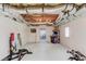 Basement with exposed ceiling and recreation equipment, with an arcade game, dart board and bicycles at 2005 Ashton Pointe Dr, Dacula, GA 30019