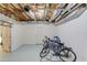 Storage basement with exposed ceiling featuring bicycles and a pull-up bar at 2005 Ashton Pointe Dr, Dacula, GA 30019