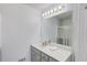 Bright bathroom featuring a large mirror, a sink with vanity, and a shower, creating a clean and modern space at 2005 Ashton Pointe Dr, Dacula, GA 30019