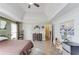 Primary bedroom boasts tray ceiling, a ceiling fan, and is painted in neutral colors at 2005 Ashton Pointe Dr, Dacula, GA 30019